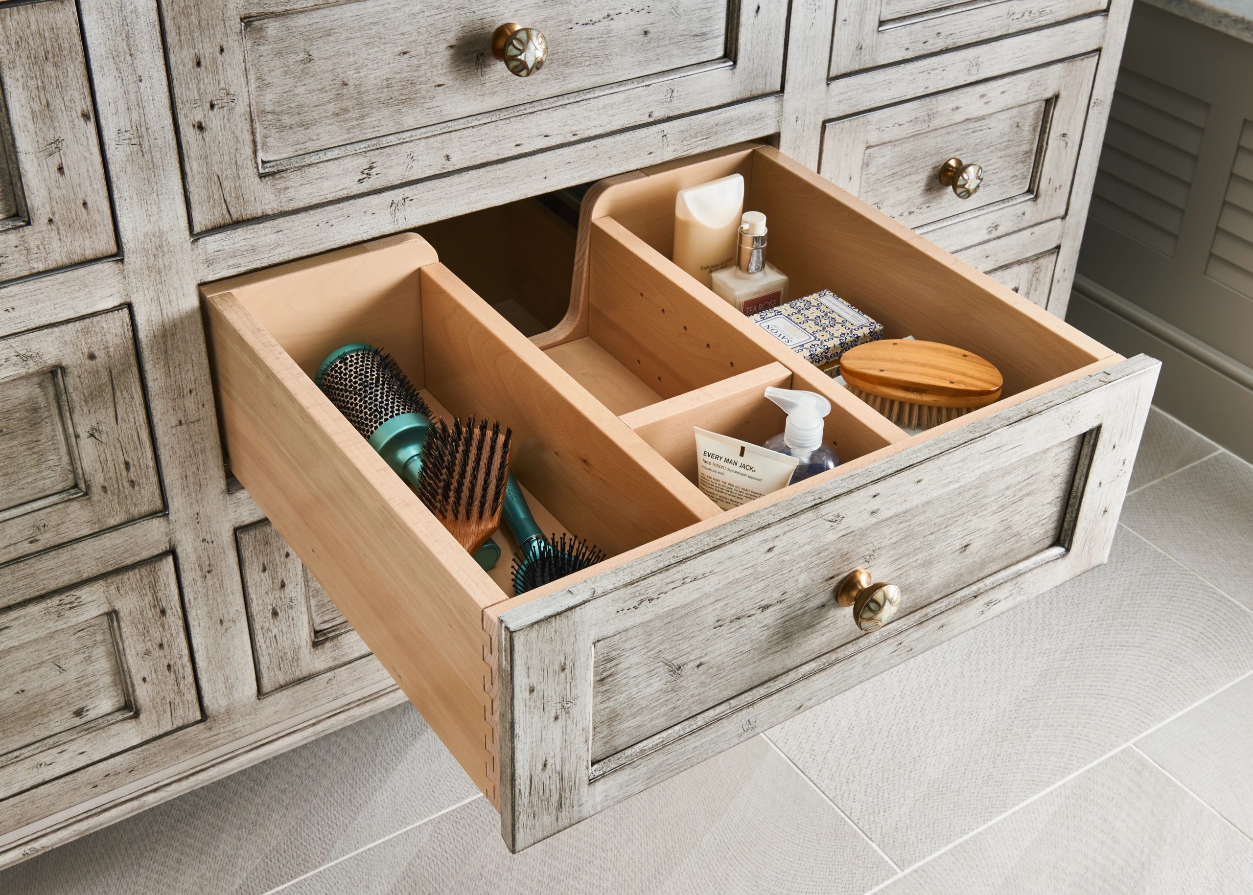 Bathroom cabinetry with drawers and linen storage