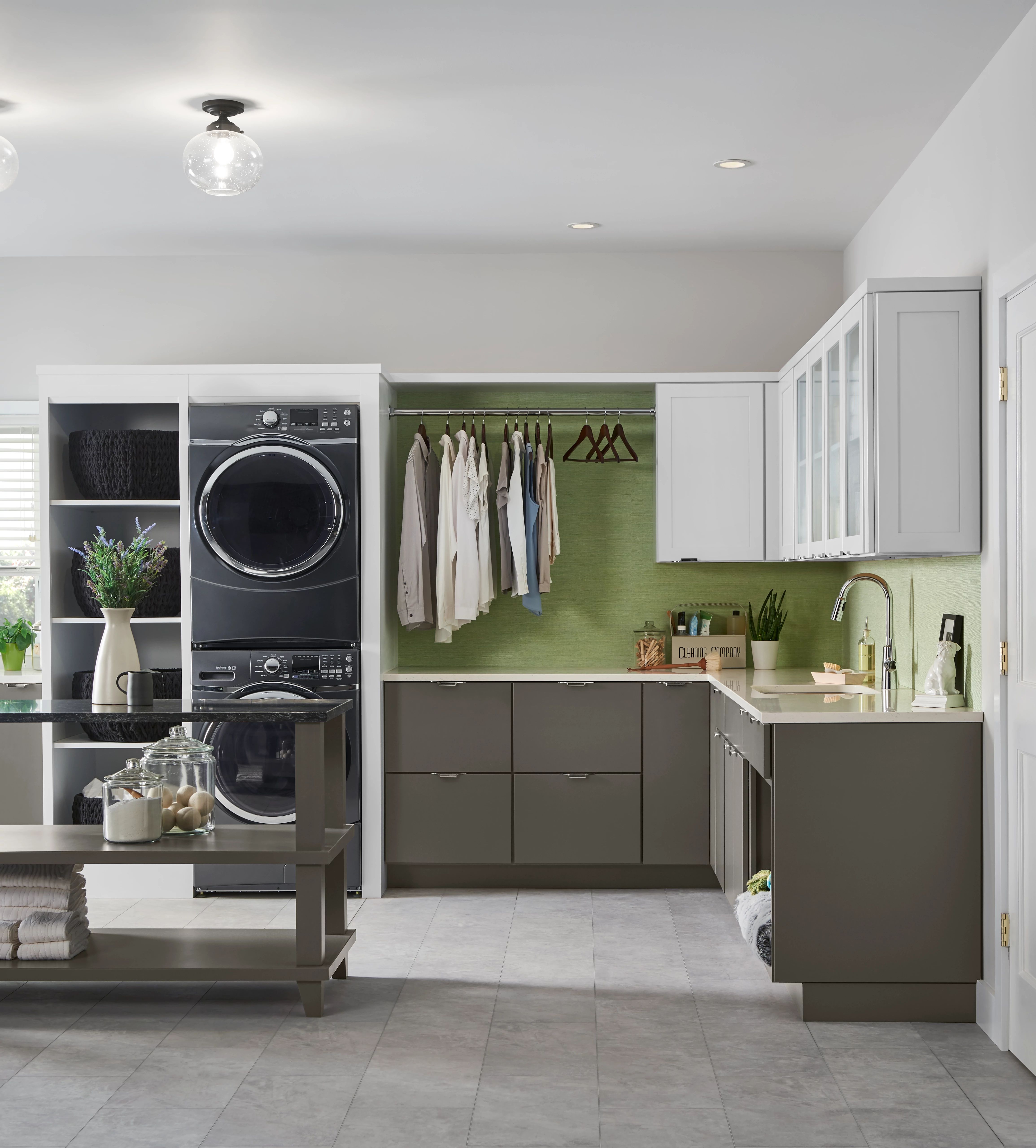 Laundry room cabinets with countertop folding station
