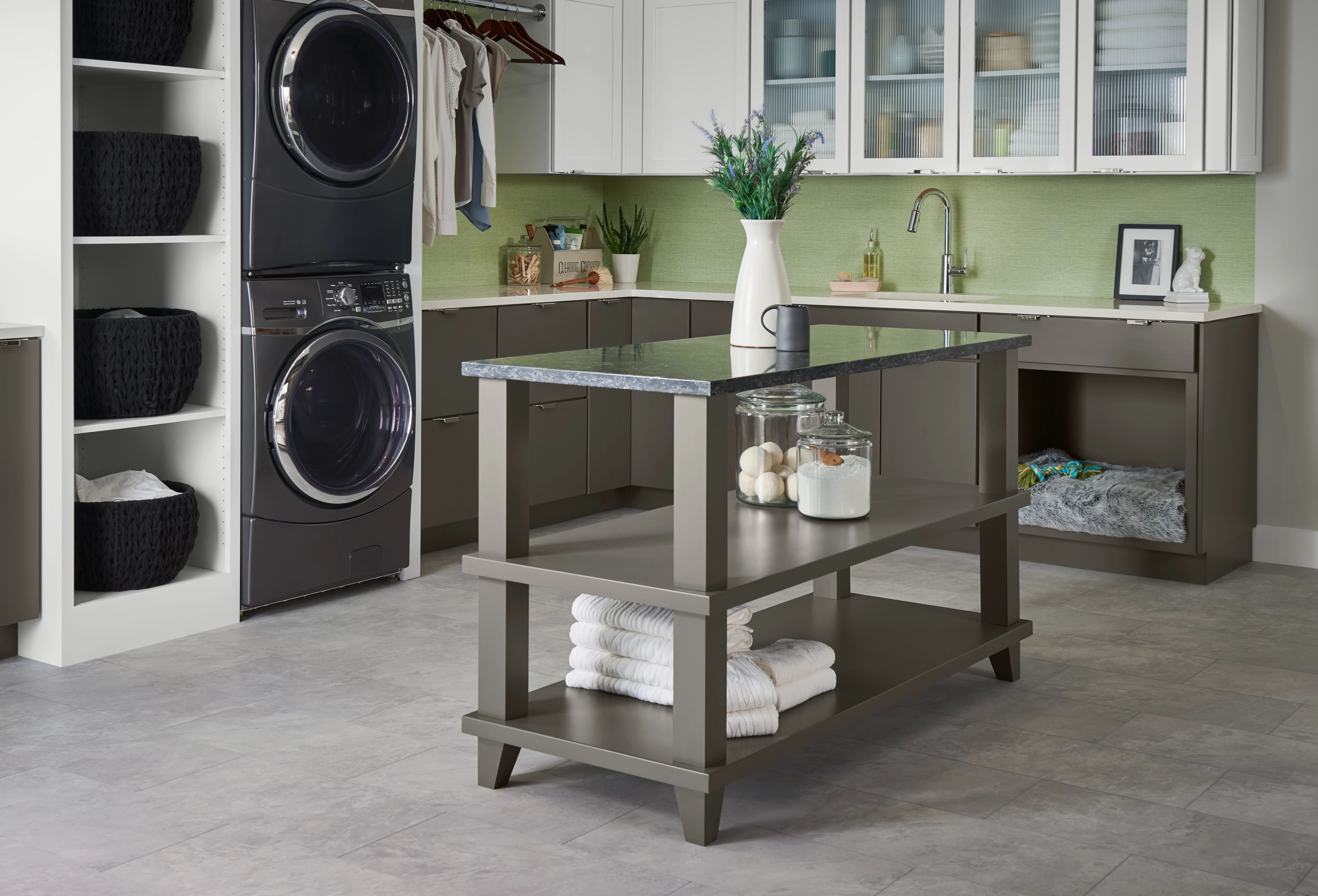 Laundry room cabinets with countertop folding station