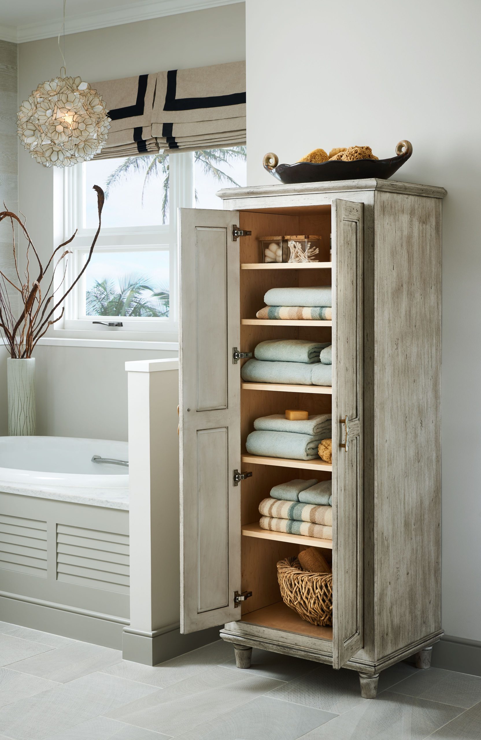 Bathroom cabinetry with drawers and linen storage