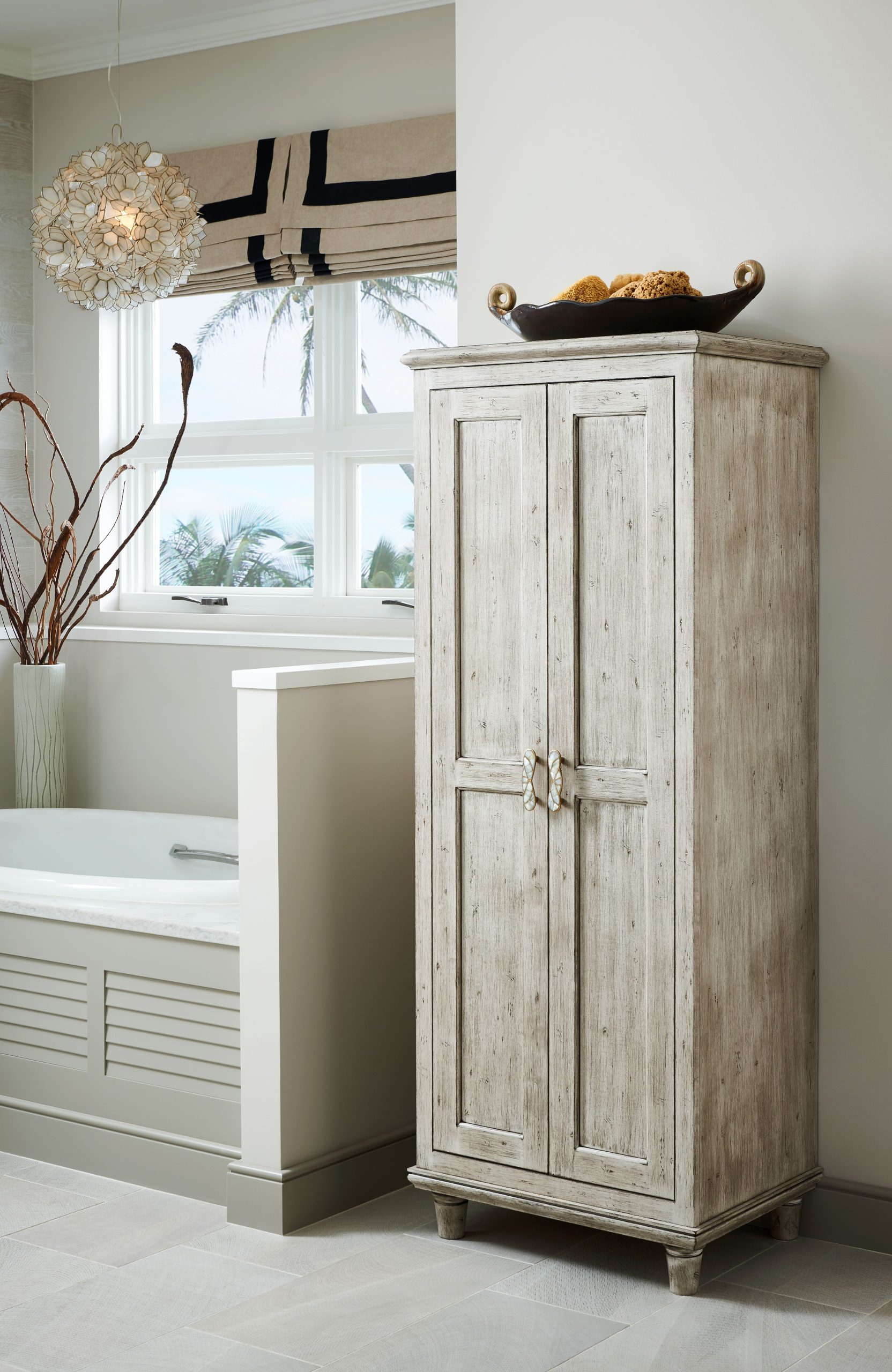 Bathroom cabinetry with drawers and linen storage