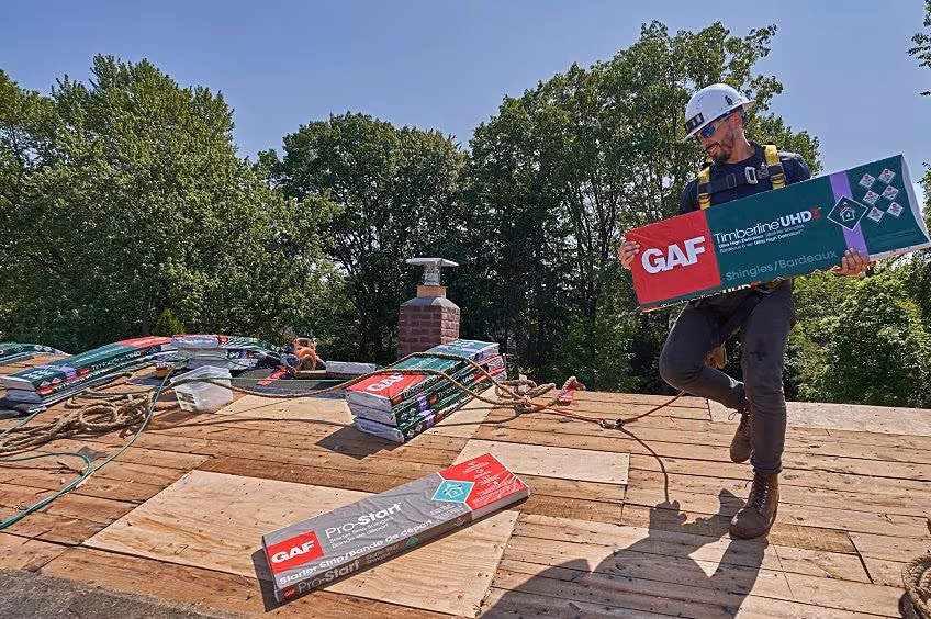 Contractor installing GAF residential roofing products on an Iowa home